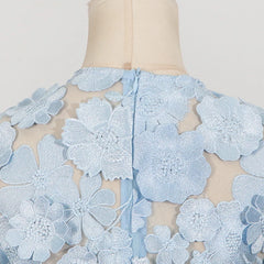 Light blue floral lace on a mannequin against a white background