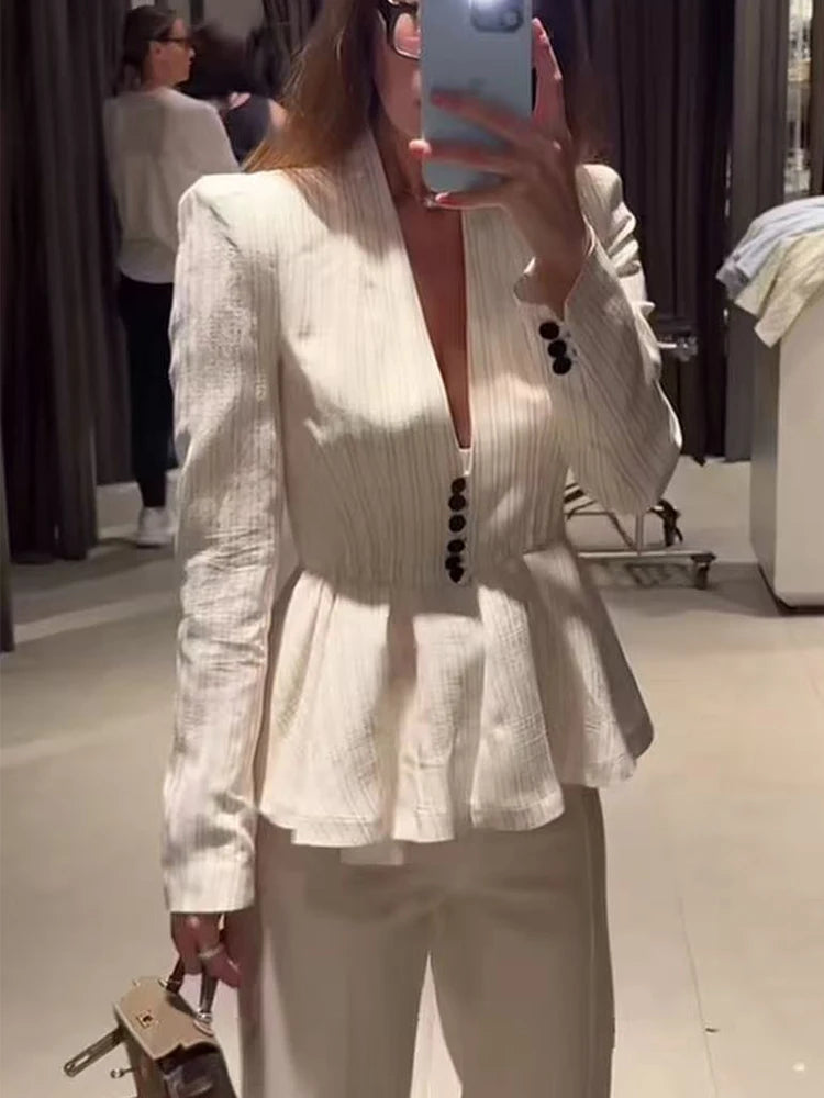 Close-up of the striped peplum blazer jacket.
