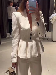 Close-up of the striped peplum blazer jacket.
