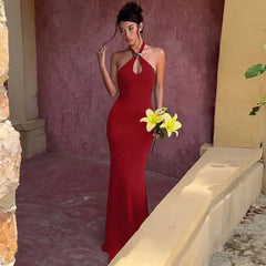 Red halter neck maxi dress with gold ring detail