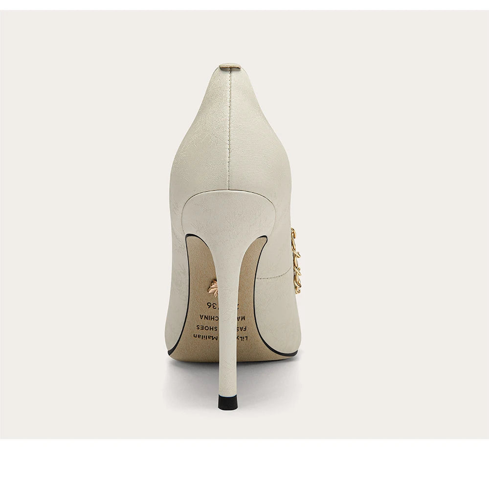 White high-heeled shoe with a stiletto heel on a white background