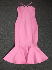 Pink dress with a fitted bodice and flared skirt on a dark gray background