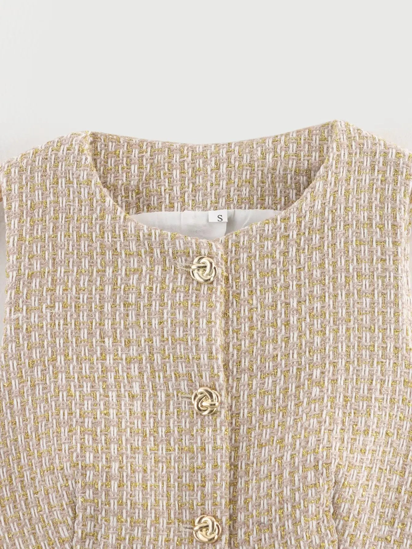 Textured shirt with buttons on a light gray background