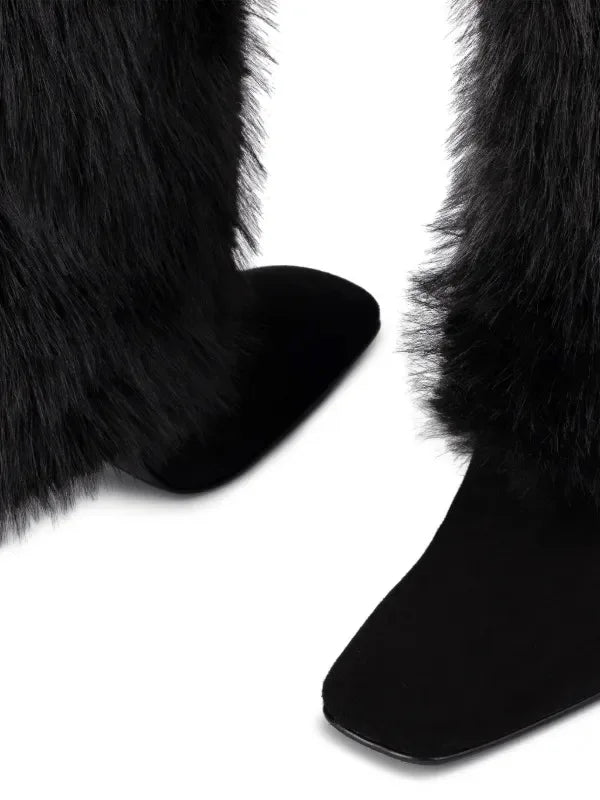 Close-up of black fur-trimmed boots