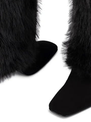 Close-up of black fur-trimmed boots