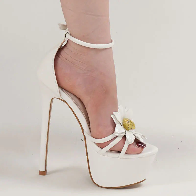 White high-heeled shoe with a bow and platform on a light background