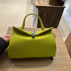 Lime green structured handbag with a silver metal buckle