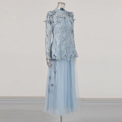 Light blue lace dress on a mannequin against a white background