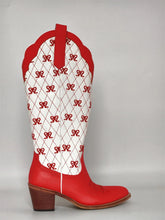 Red cowboy boot with white pattern on a gray background