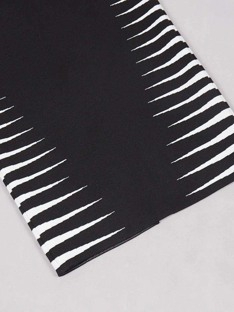 Black and white striped fabric on a light gray background