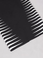 Black and white striped fabric on a light gray background