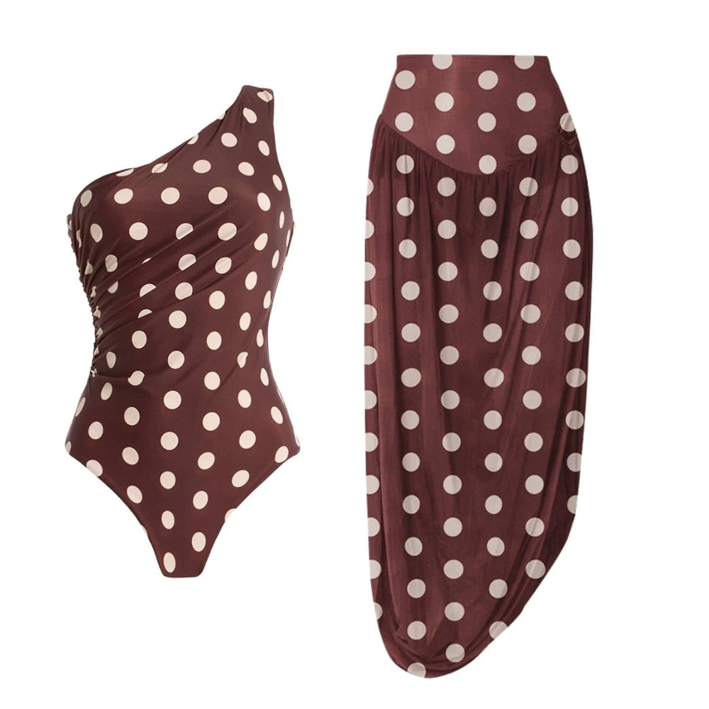 Model wearing polka dot one-shoulder swimsuit
