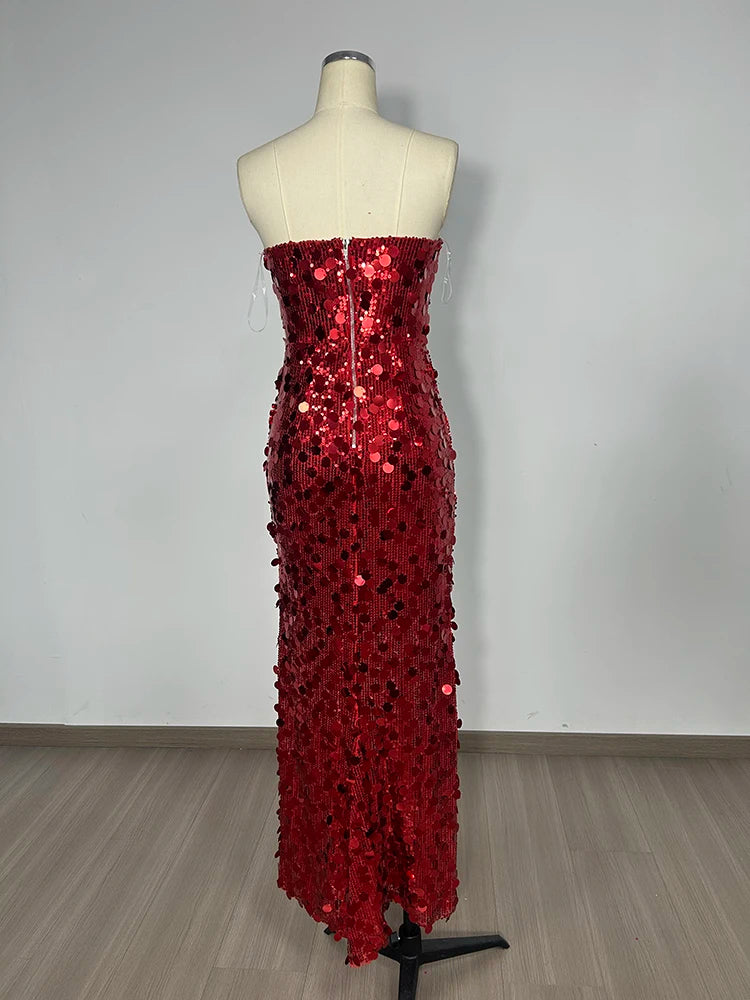Red sequin dress on a mannequin against a plain background