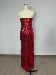 Red sequin dress on a mannequin against a plain background