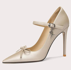 Beige high-heeled shoe with a bow detail on a white background