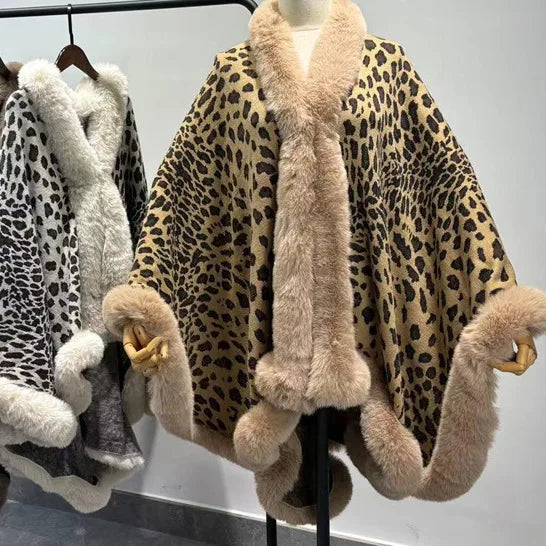 Leopard print fur coat with beige trim on a mannequin against a neutral background