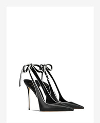 Black high-heeled shoes with ankle ties on a white background