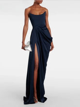 Navy blue strapless gown with a high slit