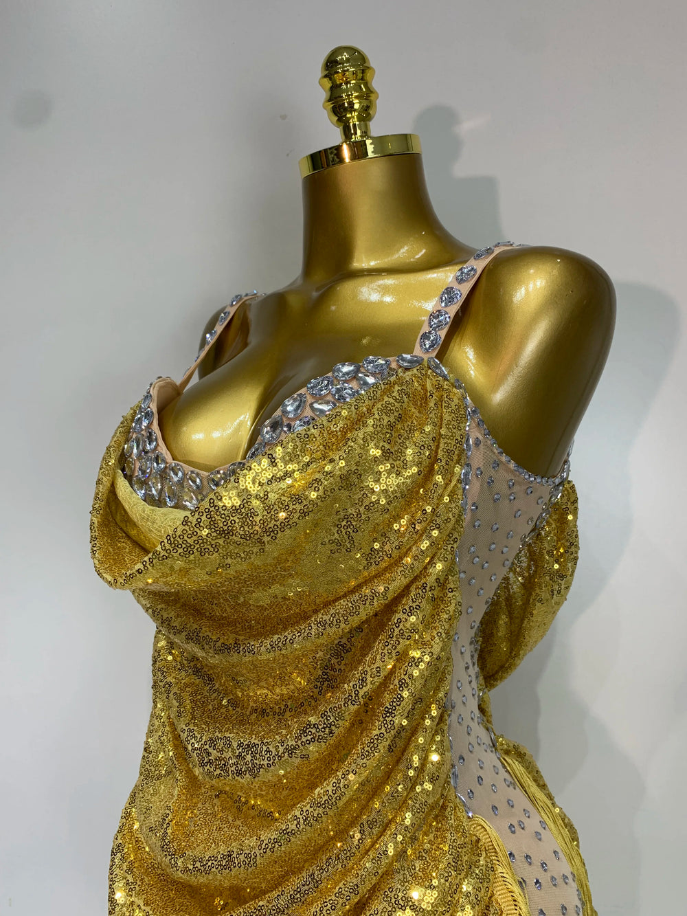 Close-up of gold sequin cowl neck bodysuit neckline