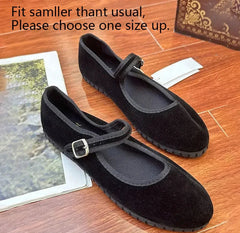 Black velvet Mary Jane flats with a silver buckle strap.