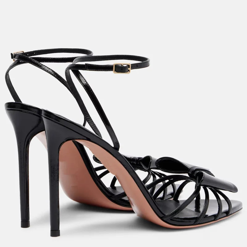 Black patent leather thin heel sandals with bow detail