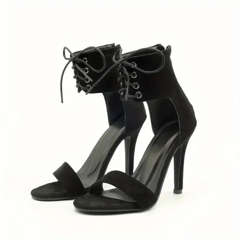 Pair of black lace-up stiletto heels with open toe