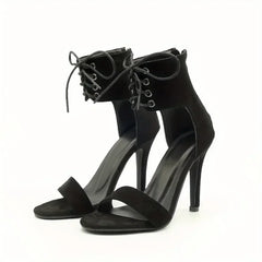 Pair of black lace-up stiletto heels with open toe