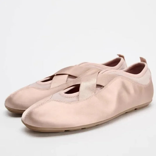 Pink satin ballet flats with crisscross straps