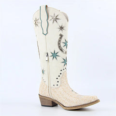 White cowboy boot with star and horseshoe designs on a white background