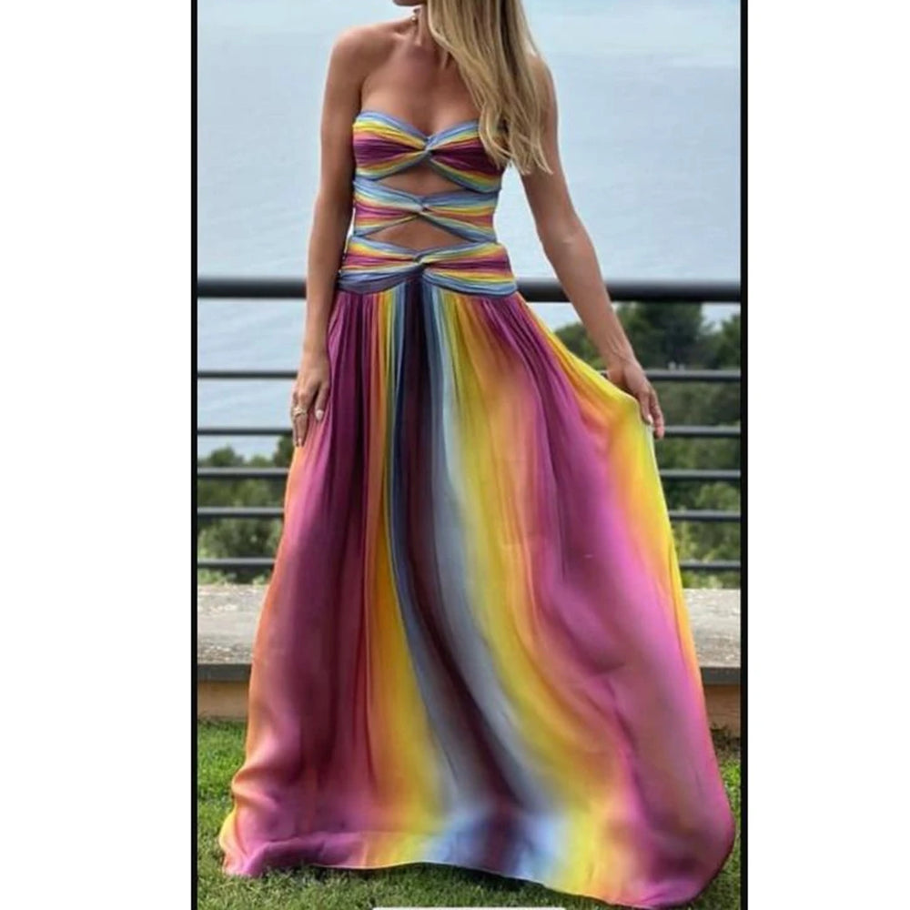 Woman wearing a colorful strapless dress with a blurred outdoor background