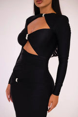 Black dress with cut-out design on a white background