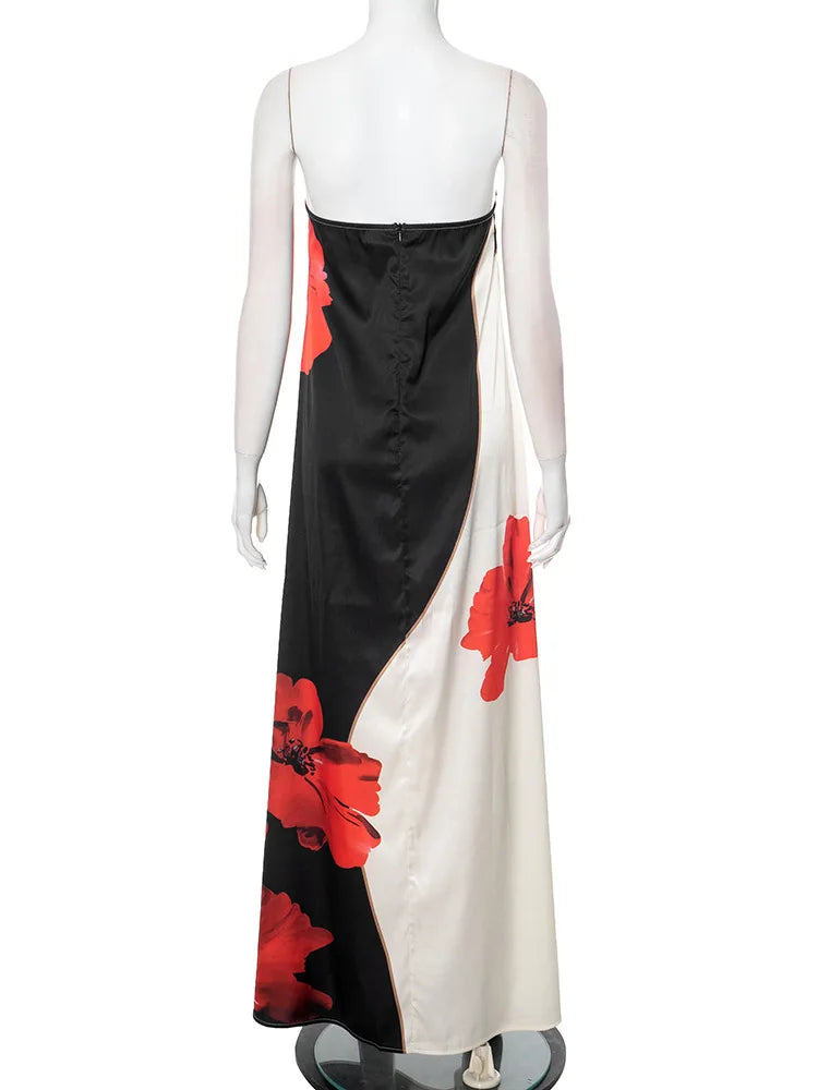 Mannequin wearing a black and white dress with red floral patterns