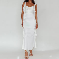 White dress with ruffled sleeves on a plain background