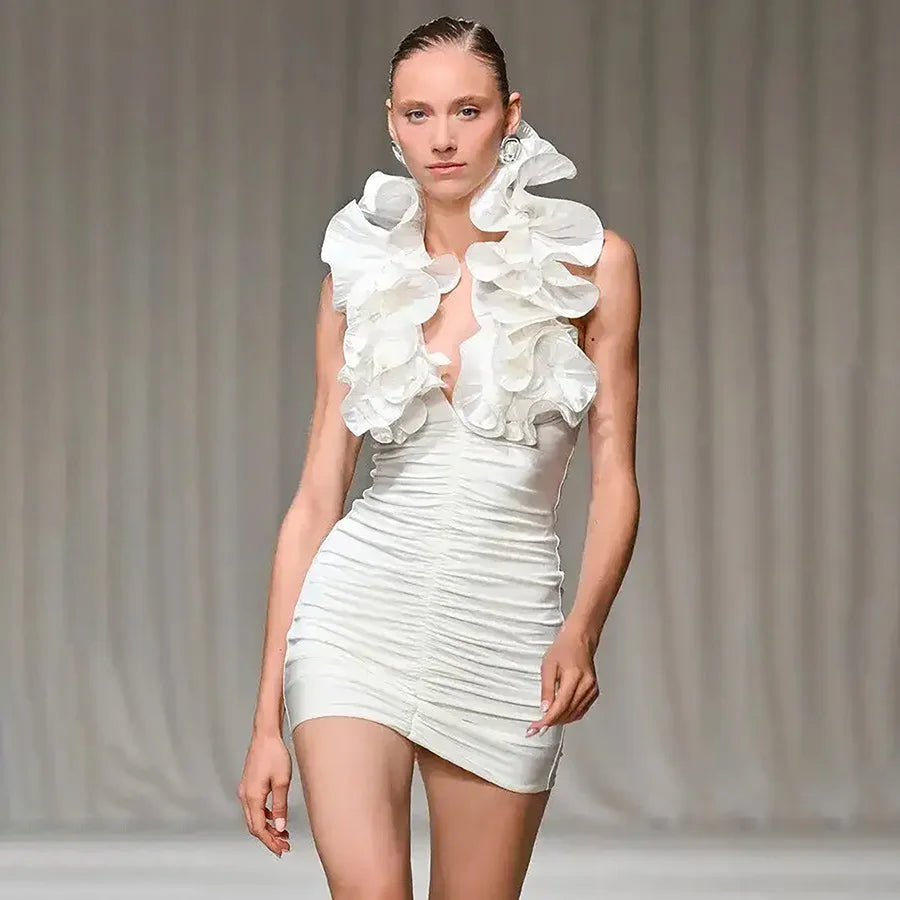 Close-up of ruffled neck halter mini dress