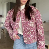 Floral quilted puffer jacket on a model