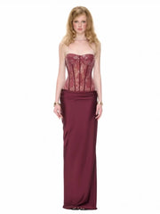 Burgundy sequin strapless corset maxi dress on a model