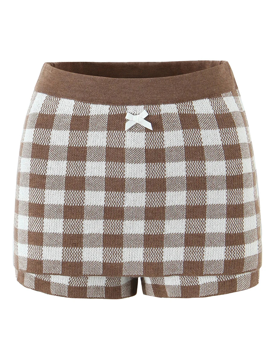 Brown and white checkered shorts with a bow detail on a white background