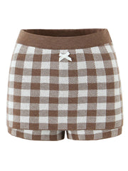 Brown and white checkered shorts with a bow detail on a white background