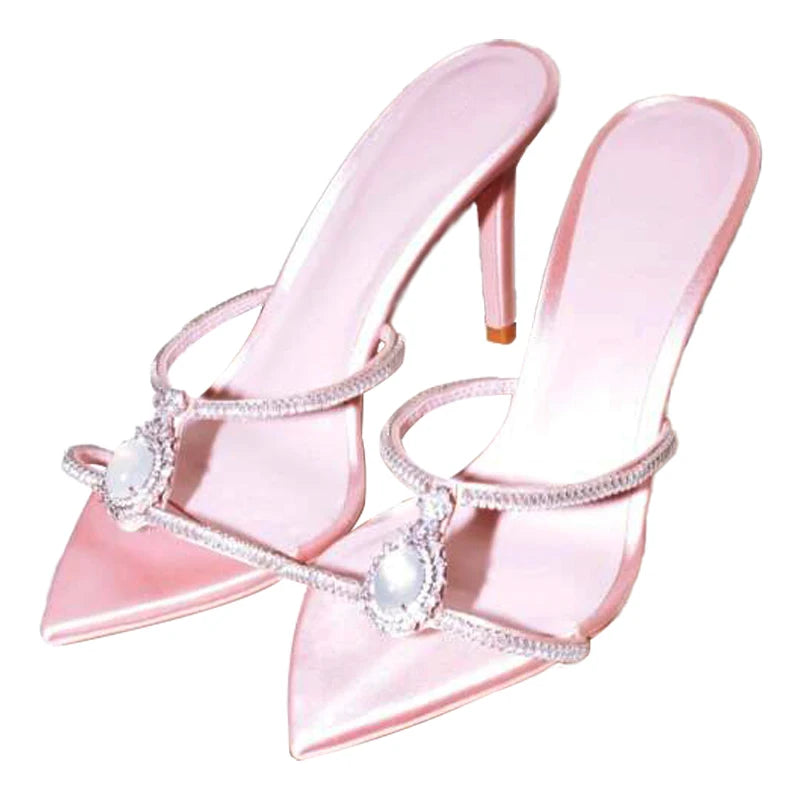 Pink high-heeled shoes with decorative elements