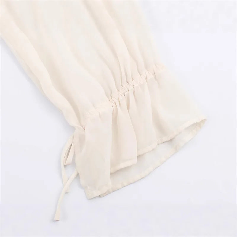 Beige drawstring bag on a white background