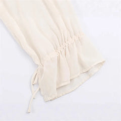 Beige drawstring bag on a white background