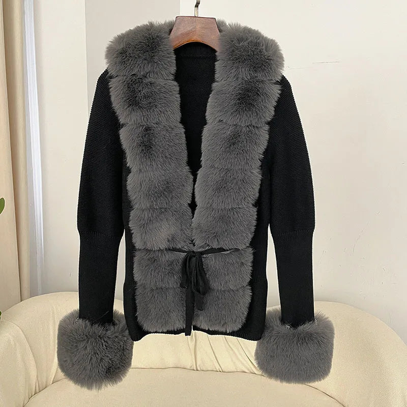 Black coat with gray fur trim on a beige chair