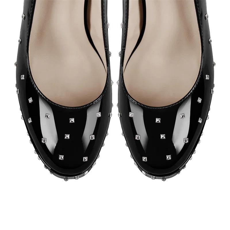 Top view of black studded patent leather pointed toe heels