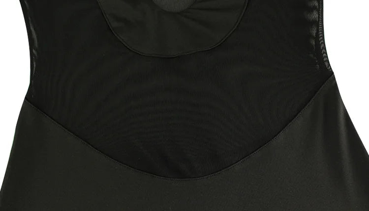 Close-up of a black garment with a textured pattern on a white background