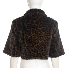 Leopard print fur jacket on a mannequin against a white background