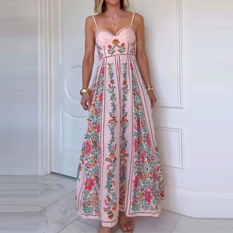Woman wearing a floral dress standing against a white door.