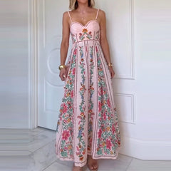 Woman wearing a floral dress standing against a white door.