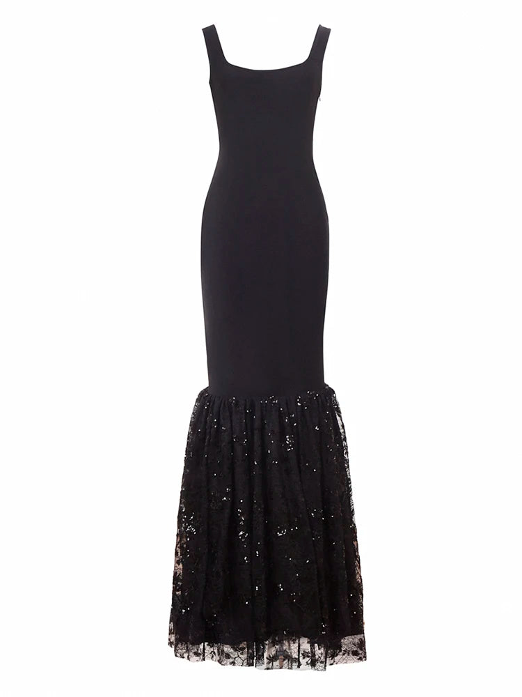 Black dress with a sequined skirt on a white background