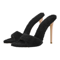 Close-up of green fluffy pointed toe stiletto heels