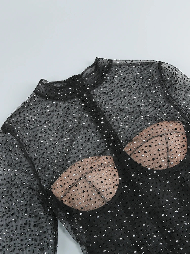 Black sequin top with beige circular patterns on a light gray background